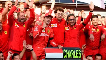 TOPSHOT - Winner Ferrari's Monegasque driver Charles Leclerc (C-L) and Ferrari's team principal
