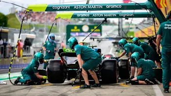 TOPSHOT - Aston Martin's German driver Sebastian Vettel arrives for a pit stop during the second