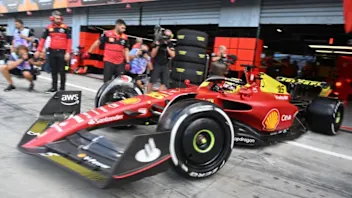 Ferrari's Monegasque driver Charles Leclerc steers his car in the pit lane during the first