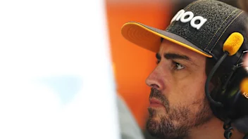 MONZA, ITALY - SEPTEMBER 06: Fernando Alonso of Spain and McLaren F1 looks on in the garage during