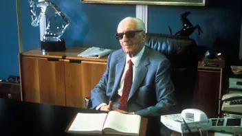 Enzo Ferrari  the founder of the Scuderia Ferrari Grand Prix motor racing team sits at his office
