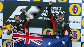 3 Mar 2002: Mark Webber of Australia and Minardi celebrates with team boss Paul Stoddart after his