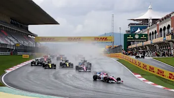 Racing Point's Canadian driver Lance Stroll (R) leads at the start of the Turkish Formula One Grand