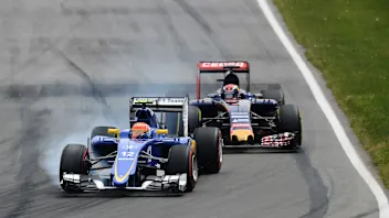 Felipe Nasr (BRA) Sauber C34 locks up in front of Max Verstappen (NDL) Scuderia Toro Rosso STR10 at