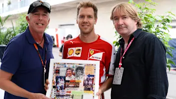 Keith Sutton (GBR) Sutton Images CEO, Sebastian Vettel (GER) Ferrari and Mark Dickens (GBR) Artist