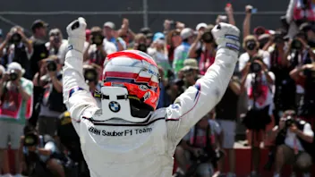 Robert Kubica (POL) BMW Sauber F1 celebrates his first win in parc ferme.
Formula One World