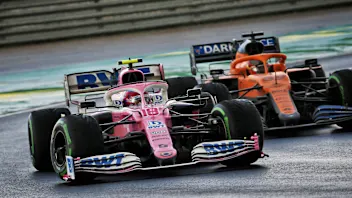 Lance Stroll (CDN) Racing Point F1 Team RP20 and Carlos Sainz Jr (ESP) McLaren MCL35 battle for