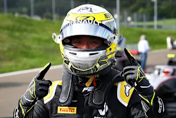 SPIELBERG, AUSTRIA - JULY 03: Guanyu Zhou of China and UNI-Virtuosi Racing celebrates getting pole