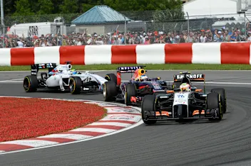 Sergio Perez (MEX) Force India VJM07 leads Sebastian Vettel (GER) Red Bull Racing RB10 and Felipe