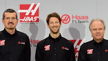 (L-R) Gunther Steiner, team principal of Haas F1 Team, Romain Grosjean of France, and Gene Haas,