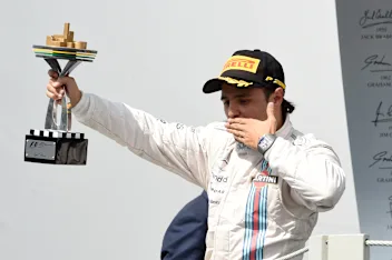 Felipe Massa (BRA) Williams celebrates on the podium with the trophy. Formula One World