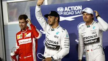 (L to R): Sebastian Vettel (GER) Ferrari, pole sitter Lewis Hamilton (GBR) Mercedes AMG F1 and Nico