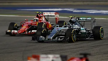 Nico Rosberg (GER) Mercedes AMG F1 W06 and Kimi Raikkonen (FIN) Ferrari SF15-T battle at Formula