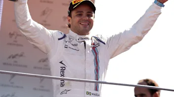Felipe Massa (BRA) Williams celebrates on the podium with the trophy at Formula One World