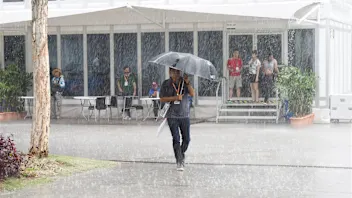 Rain in the Paddock at Formula One World Championship, Rd2, Malaysian Grand Prix, Qualifying,