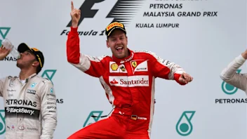 Race winner Sebastian Vettel (GER) Ferrari celebrates on the podium at Formula One World