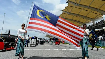 Grid girls with Malaysian flag on the grid at Formula One World Championship, Rd2, Malaysian Grand