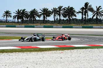 Lewis Hamilton (GBR) Mercedes AMG F1 W06 and Kimi Raikkonen (FIN) Ferrari SF15-T at Formula One