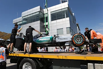 The car of Lewis Hamilton (GBR) Mercedes AMG F1 W06 is recovered to the pits in Free Practice One