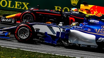 Pascal Wehrlein (GER) Sauber C36 and Daniel Ricciardo (AUS) Red Bull Racing RB13 at Formula One