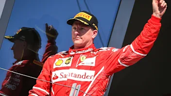Kimi Raikkonen (FIN) Ferrari celebrates on the podium at Formula One World Championship, Rd11,