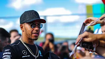 Lewis Hamilton (GBR) Mercedes AMG F1 signs autographs for the fans at the autograph session at