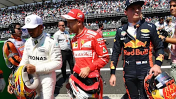 Lewis Hamilton (GBR) Mercedes AMG F1, pole sitter Sebastian Vettel (GER) Ferrari and Max Verstappen