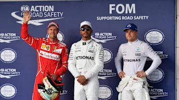 (L to R): Sebastian Vettel (GER) Ferrari, pole sitter Lewis Hamilton (GBR) Mercedes AMG F1 and