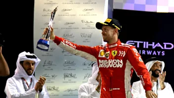 Sebastian Vettel, Ferrari celebrates on the podium with the trophy at Formula One World