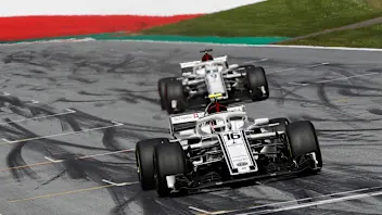 Charles Leclerc (MON) Alfa Romeo Sauber C37 and Marcus Ericsson (SWE) Alfa Romeo Sauber C37 cross