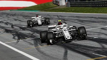 Charles Leclerc (MON) Alfa Romeo Sauber C37 and Marcus Ericsson (SWE) Alfa Romeo Sauber C37 cross