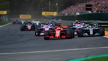 Sebastian Vettel, Ferrari SF71H leads Lewis Hamilton, Mercedes AMG F1 W09 and Esteban Ocon, Racing