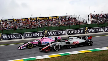 Esteban Ocon, Racing Point Force India VJM11 and Romain Grosjean, Haas F1 Team VF-18 battle at
