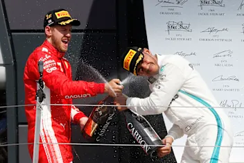 Sebastian Vettel (GER) Ferrari and Lewis Hamilton (GBR) Mercedes-AMG F1 celebrate on the podium