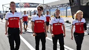 Charles Leclerc (MON) Alfa Romeo Sauber F1 Team walks the track with Xevi Pujolar (ESP) Alfa Romeo