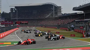 Sebastian Vettel (GER) Ferrari SF-71H leads at the start of the race at Formula One World