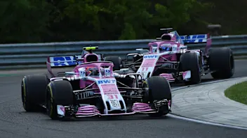 Esteban Ocon (FRA) Force India VJM11 leads Sergio Perez (MEX) Force India VJM11 at Formula One