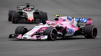Esteban Ocon, Racing Point Force India VJM11 and Romain Grosjean, Haas F1 Team VF-18 at Formula One