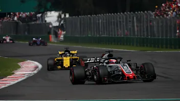 Romain Grosjean, Haas F1 Team VF-18 and Nico Hulkenberg, Renault Sport F1 Team R.S. 18 at Formula