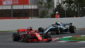 Sebastian Vettel (GER) Ferrari SF-71H leads Valtteri Bottas (FIN) Mercedes-AMG F1 W09 EQ Power+ at