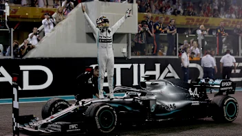 ABU DHABI, UNITED ARAB EMIRATES - DECEMBER 01: Race winner Lewis Hamilton of Great Britain and