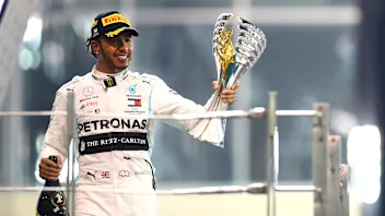 ABU DHABI, UNITED ARAB EMIRATES - DECEMBER 01: Race winner Lewis Hamilton of Great Britain and