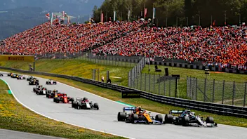 RED BULL RING, AUSTRIA - JUNE 30: Lewis Hamilton, Mercedes AMG F1 W10, leads Lando Norris, McLaren