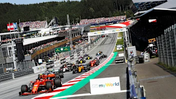 RED BULL RING, AUSTRIA - JUNE 30: Charles Leclerc, Ferrari SF90, leads Valtteri Bottas, Mercedes