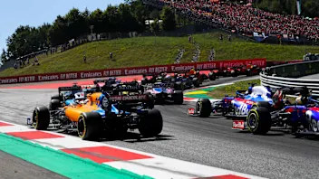 RED BULL RING, AUSTRIA - JUNE 30: Lance Stroll, Racing Point RP19, leads Carlos Sainz Jr., McLaren