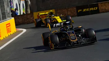 BAKU CITY CIRCUIT, AZERBAIJAN - APRIL 28: Kevin Magnussen, Haas VF-19, leads Nico Hulkenberg,