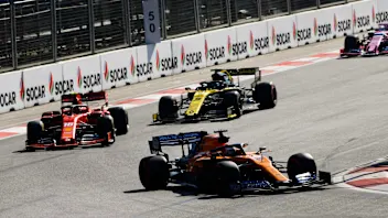 BAKU CITY CIRCUIT, AZERBAIJAN - APRIL 28: Carlos Sainz Jr., McLaren MCL34, leads Charles Leclerc,