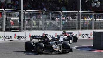 BAKU CITY CIRCUIT, AZERBAIJAN - APRIL 28: Romain Grosjean, Haas VF-19, leads Antonio Giovinazzi,
