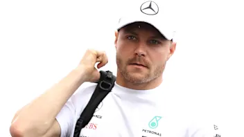 SAO PAULO, BRAZIL - NOVEMBER 14: Valtteri Bottas of Finland and Mercedes GP walks in the Paddock