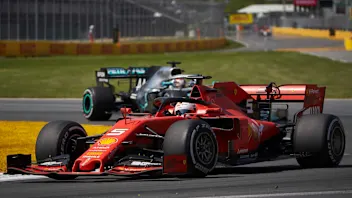 CIRCUIT GILLES-VILLENEUVE, CANADA - JUNE 09: Sebastian Vettel, Ferrari SF90, leads Lewis Hamilton,